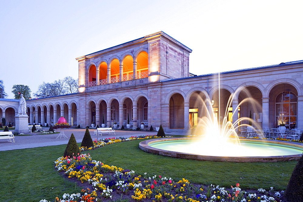 Lighted Arcade building at dusk, with Rossini-hall and arcade passage, spa garden, architect Friedrich von Gartner, Bad Kissingen District, Lower Franconia, Bavaria, Germany, Europe