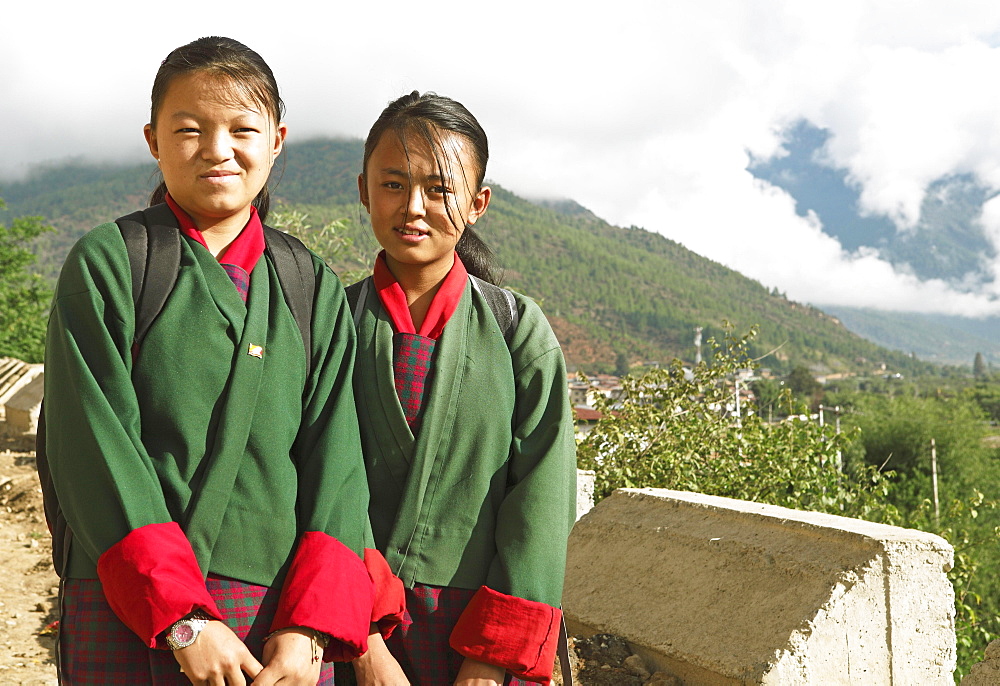 Girls wearing the traditional Kira dress in Paro, the Himalayas, Kingdom of Bhutan