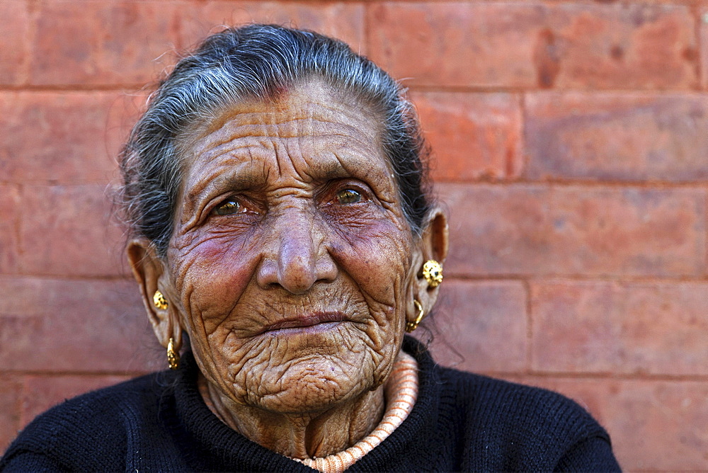 Old Nepalese woman, furrows in her face, ear jewellery, portrait, near Panauti, Nepal, Asia