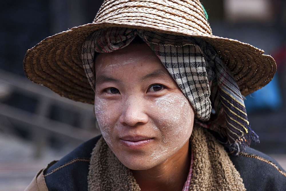 Native Woman with typical hat and Thanaka paste on the face, portrait, Nyaung Shwe, Shan State, Myanmar, Asia