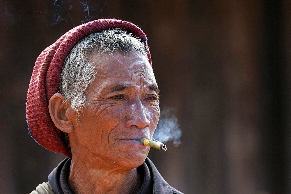 Man of the Akha ethnic group, with cigar, portrait, near Kyaing Tong, Myanmar, Asia