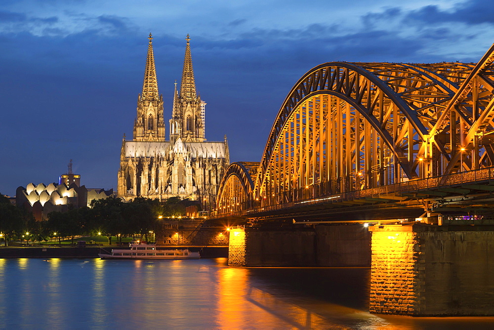 Cologne Cathedral with Hohenzollern Bridge and Cologne Philharmonic Hall at dusk, the Rhine at the front, Cologne, North Rhine-Westphalia, Germany, Europe