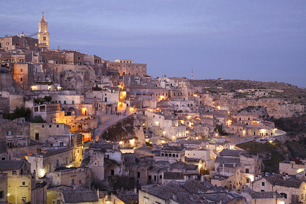 View across the town from the viewpoint at Piazzetta Pascoli, dusk, Sassi di Matera, cave dwellings, Matera, Basilicata, Italy, Europe