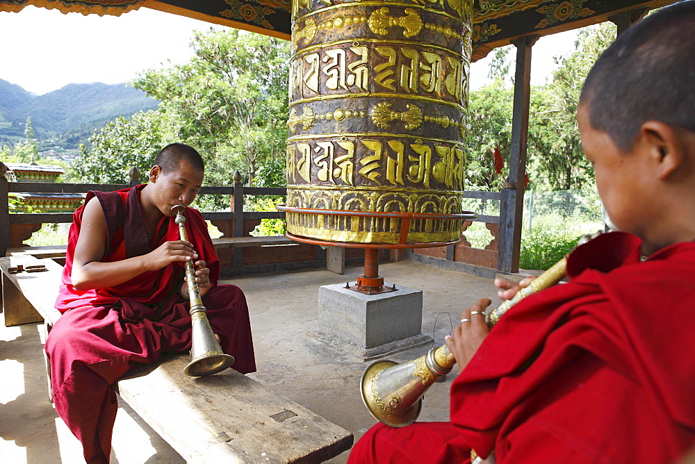 Monks playing Gyalings, Chimi Temple, Punakha District, Bhutan, Asia