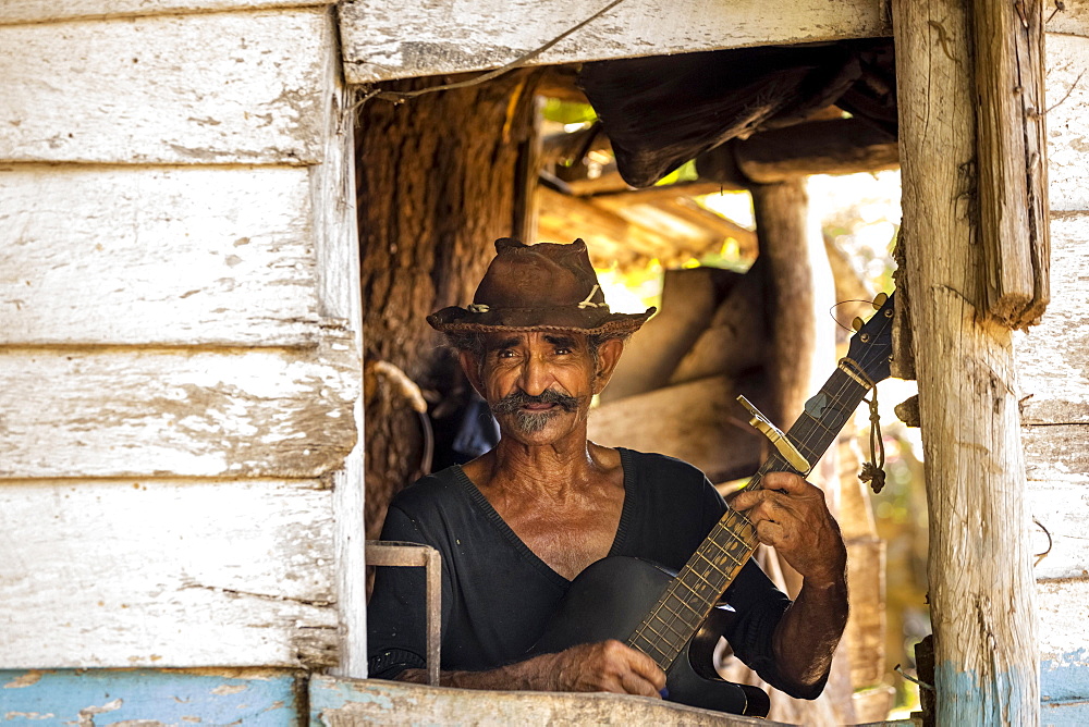 Sugar cane farmer playing the guitar, Valle de los Ingenios, Trinidad, Sancti Spiritus Province, Cuba, Central America