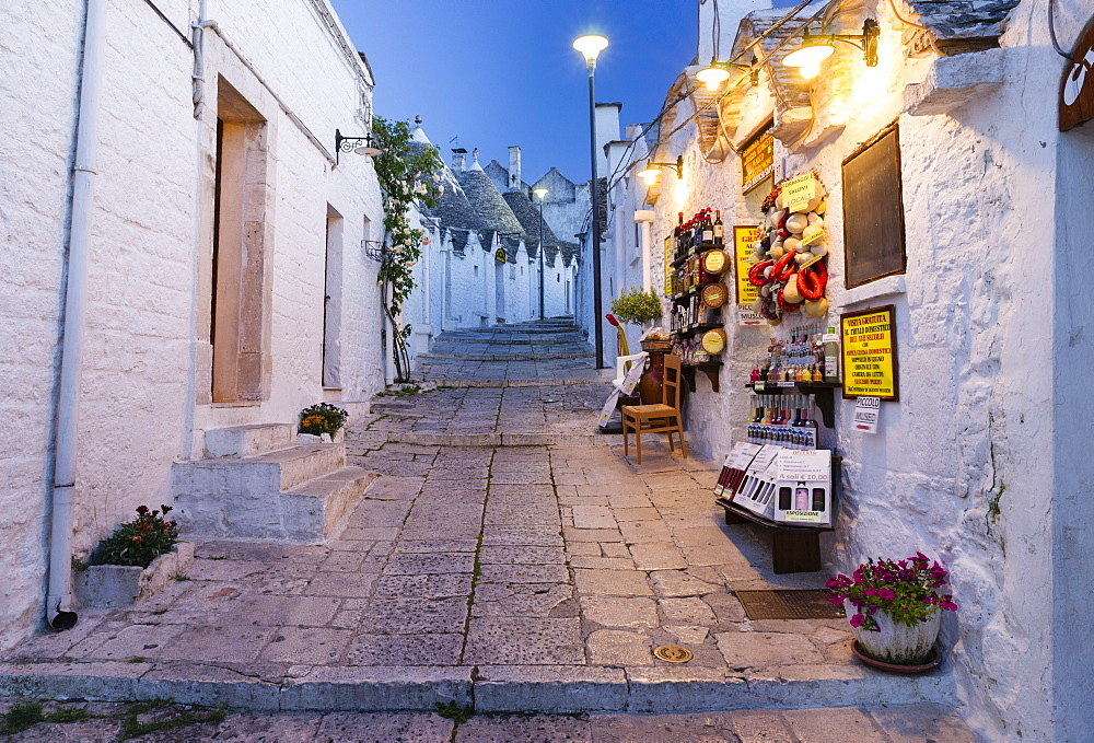 Dusk, shop, trulli traditional round houses, Rione Monti, Alberobello, Valle d'Itria, Trulli Valley, Apulia, Italy, Europe