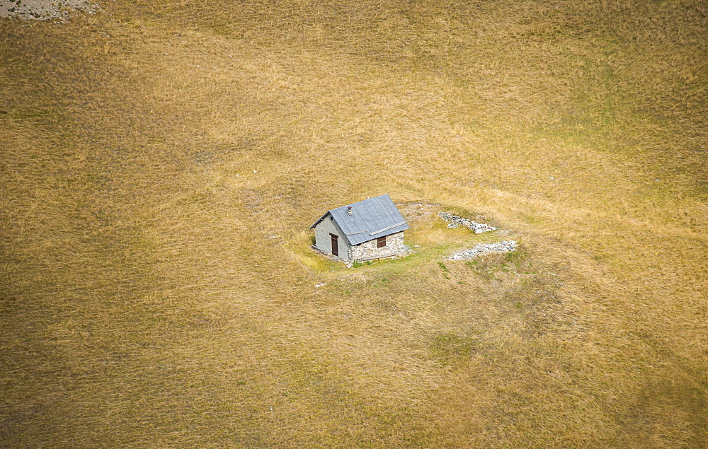 An isolated house, alone in the fields, from the Col du Galibier, Savoie, France, Europe