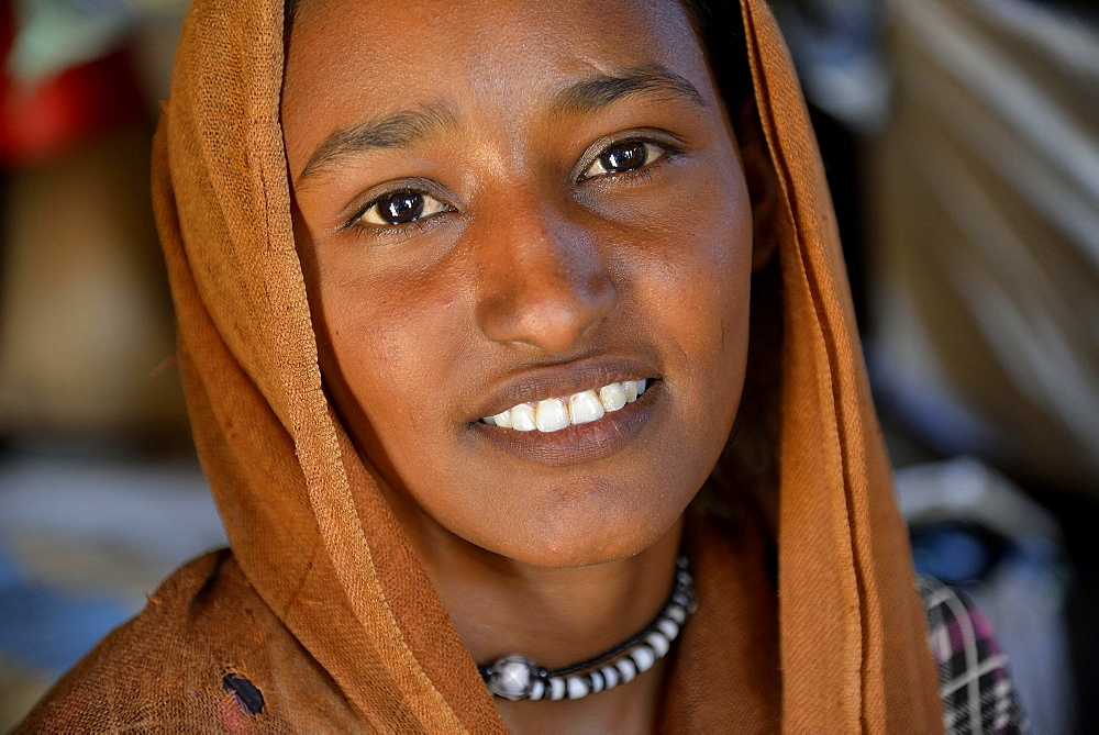 Young girl from the nomadic tribe of the Bush Arian with headgear, Portrait, Bayuda Desert, in Karima, Nubia, Northern Sudan