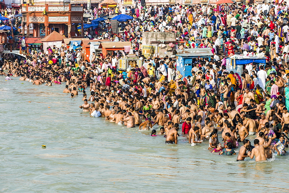 Masses of pilgrims are gathering for bathing at Harki Pauri Ghat at the holy river Ganges, Haridwar, Uttarakhand, India, Asia