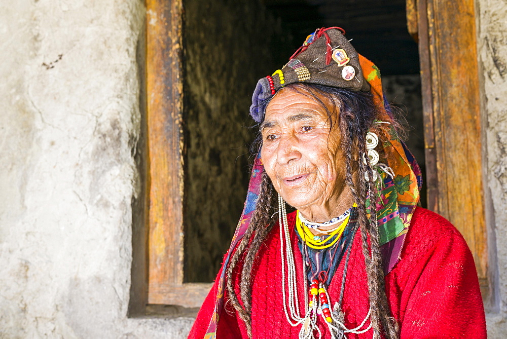 A woman of the Brokpa tribe, wearing her traditional dress with the typical flower headdress, Dah Hanu, Jammu and Kashmir, India, Asia