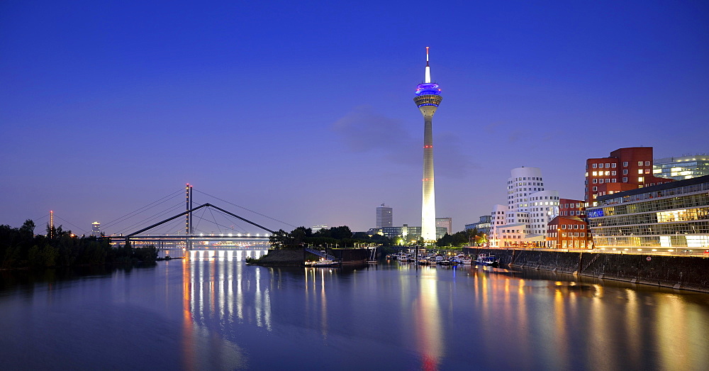 Rhine tower, Gehry Buildings, Neuer Zollhof, media harbor, dusk, blue hour, Dusseldorf, North Rhine-Westphalia, Germany, Europe