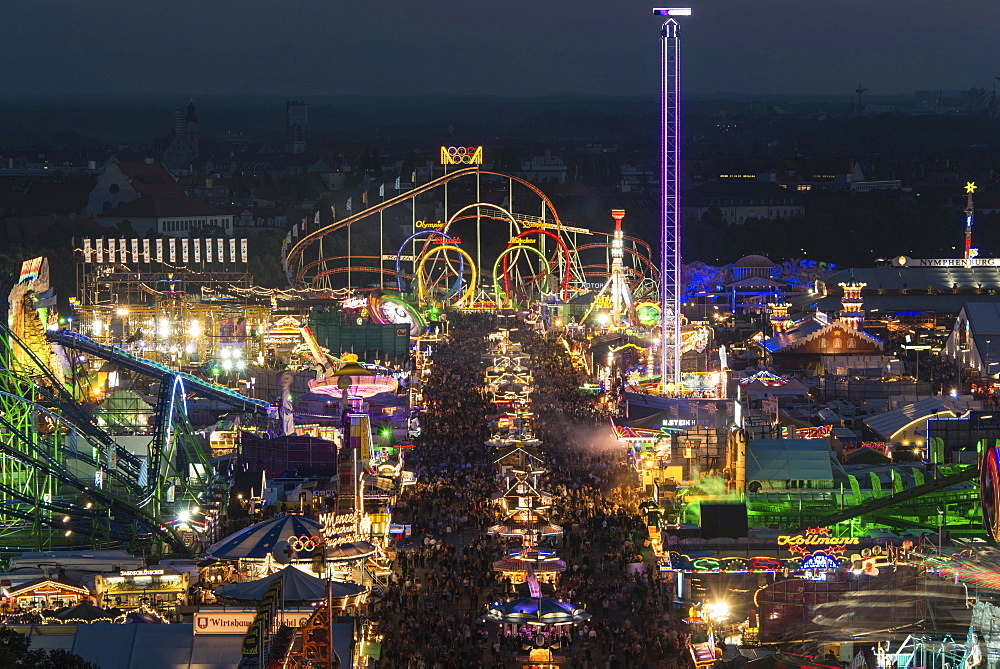 Rides on the fairground road with Olympia Looping, Funferlooping roller coaster at night, Oktoberfest, Theresienwiese, Munich, Upper Bavaria, Bavaria, Germany, Europe