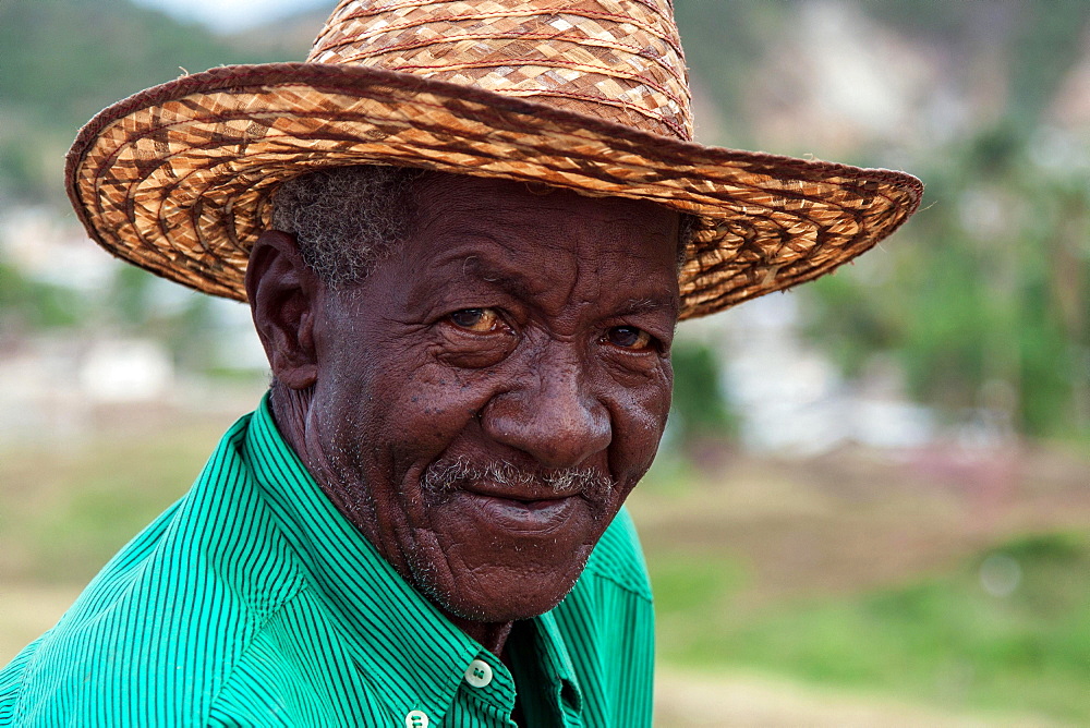 Cuban man wearing a straw hat, portrait, near Santiago de Cuba, Cuba, Central America