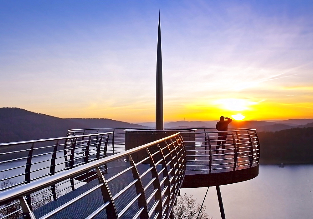 Viewing platform Biggeblick with a person at sunset, Biggesee reservoir, Attendorn, Sauerland, North Rhine-Westphalia, Germany, Europe