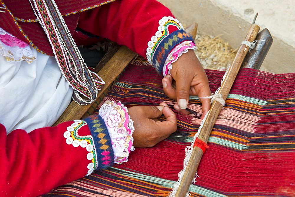 Hands of a woman, Quechua Indian, at work on a loom, Cinchero, Urubamba Valley, Peru, South America