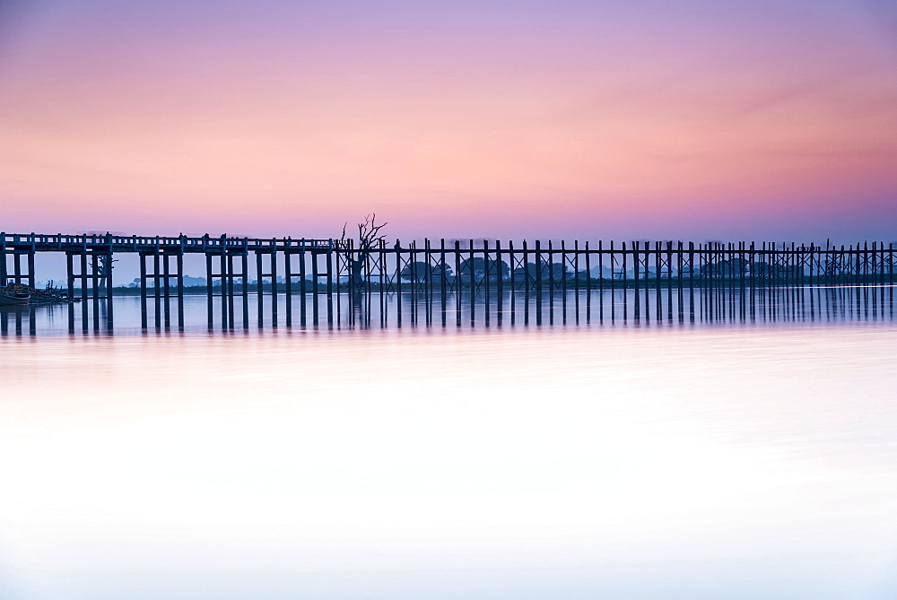 Teak bridge in the evening light, U Bein bridge across Thaungthaman Lake, Amarapura, Mandalay Division, Myanmar, Asia