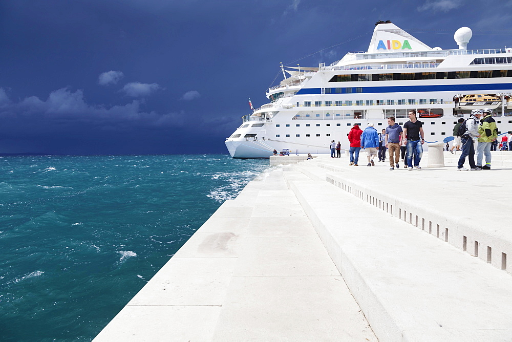 Sea Organ with a cruise ship, with impending thunderstorm, Zadar, Dalmatia, Croatia, Europe