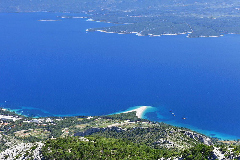 View from Vidova Gora on the town of Bol, Zlatni Rat or Golden Horn and the island of Hvar at the back, island of Brac, Dalmatia, Croatia, Europe