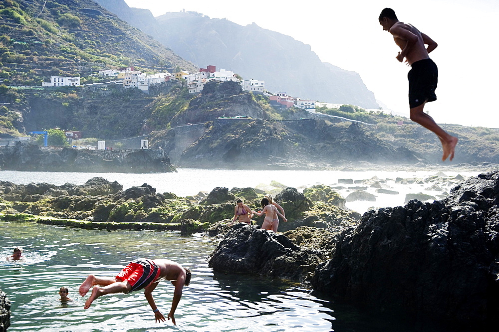 Swimming fun, lava coast near Garachico, Tenerife, Canary Islands, Spain, Europe