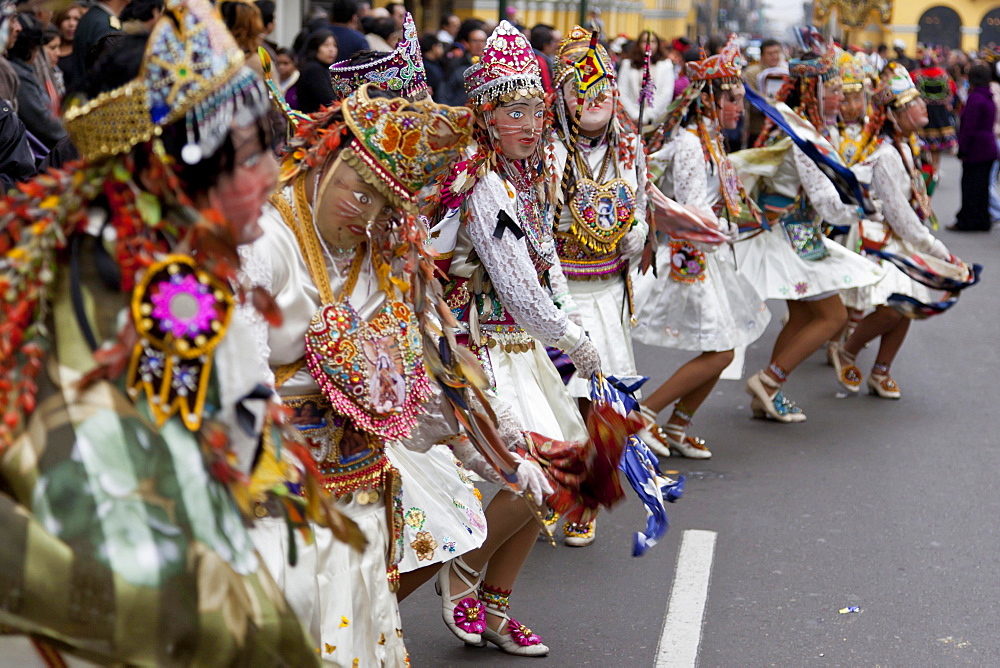 Dancing masks at the Fiesta del Carmen, Lima, Peru, South America