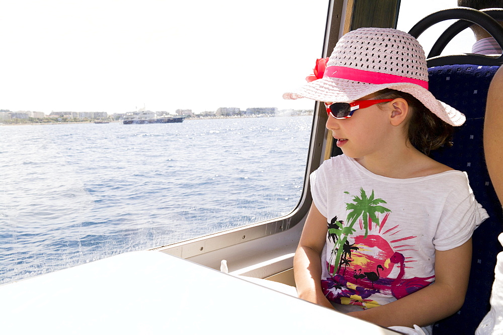 Girl, seven years old, on holiday boat trip, France, Europe