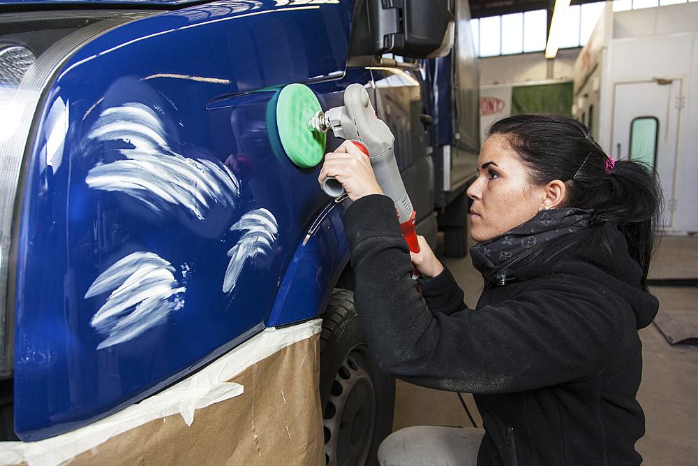 Garage, coachbuilder polishing a vehicle, Dusseldorf, North Rhine-Westphalia, Germany, Europe