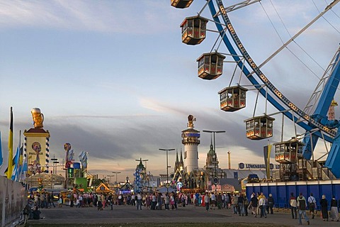 Ferris wheel, Oktoberfest, Wiesn, dawn, Wirtsbudenstrasse and Paulskirche or St. Paul's church in the back, Munich, Upper Bavaria, Germany, Europe