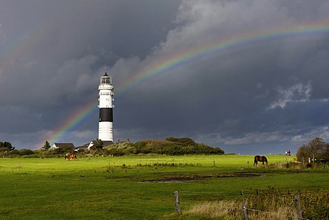 Lighthouse in Kampen on Sylt with a rainbow on the horizon shortly after a thundershower, Kampen, Sylt, North Frisia, Schleswig-Holstein, Germany, Europe