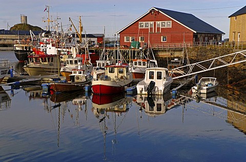 Boats and their reflections in the harbor of Sto, Sto, on the island of Langoya, Langoya, part of the VesterÃ‚len, Vesteralen archipelago, Nordland, Norway, Europe