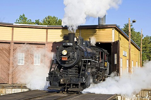 Old steam locomotive, 7470 model, driving out of the heating house, Conway Scenic Railroad in Conway, New Hampshire, USA