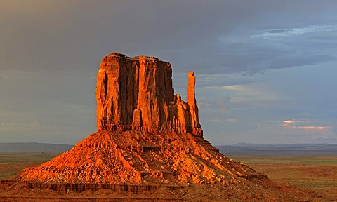 West Mitten Butte in the last light of the day during a thunderstorm, Monument Valley, Arizona, USA