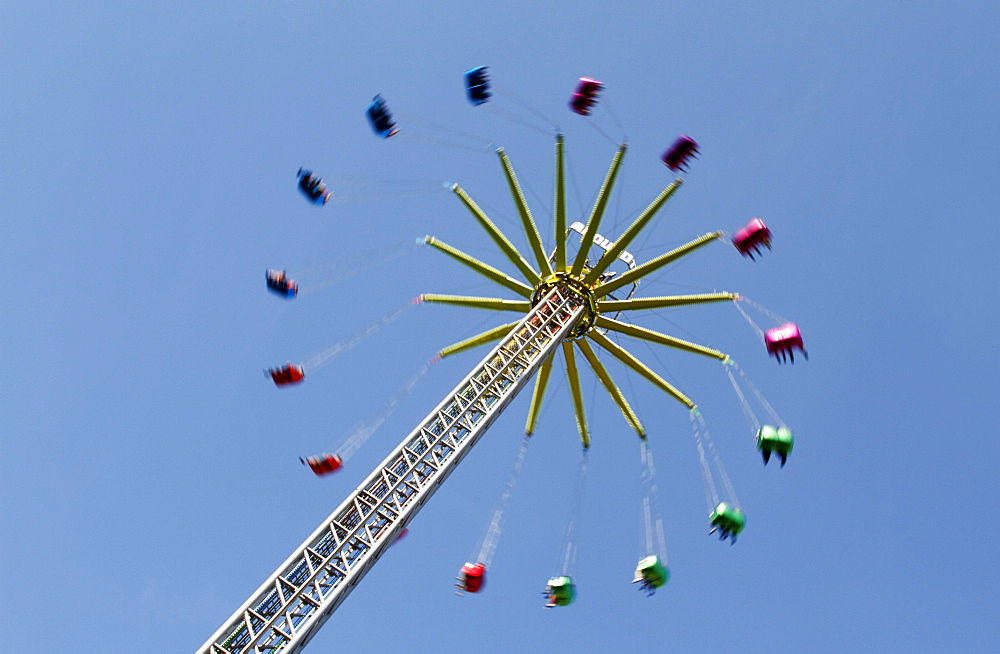 Ferris wheel spider against a blue sky