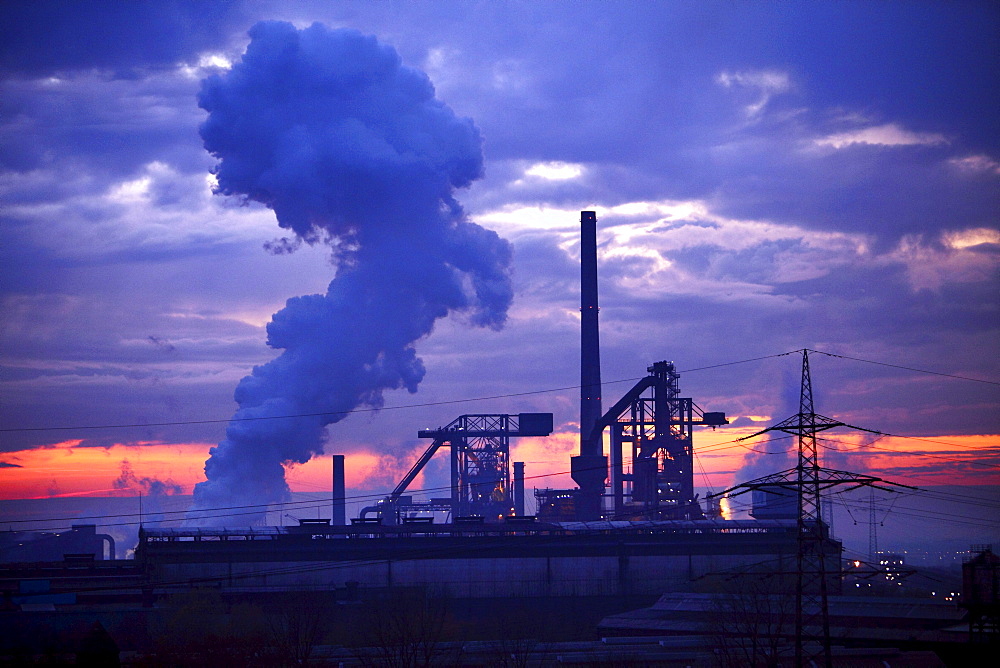 Blast furnaces of Huettenwerke Krupp Mannesmann, HKM Steelworks, at sunset, Duisburg, North Rhine-Westphalia, Germany, Europe