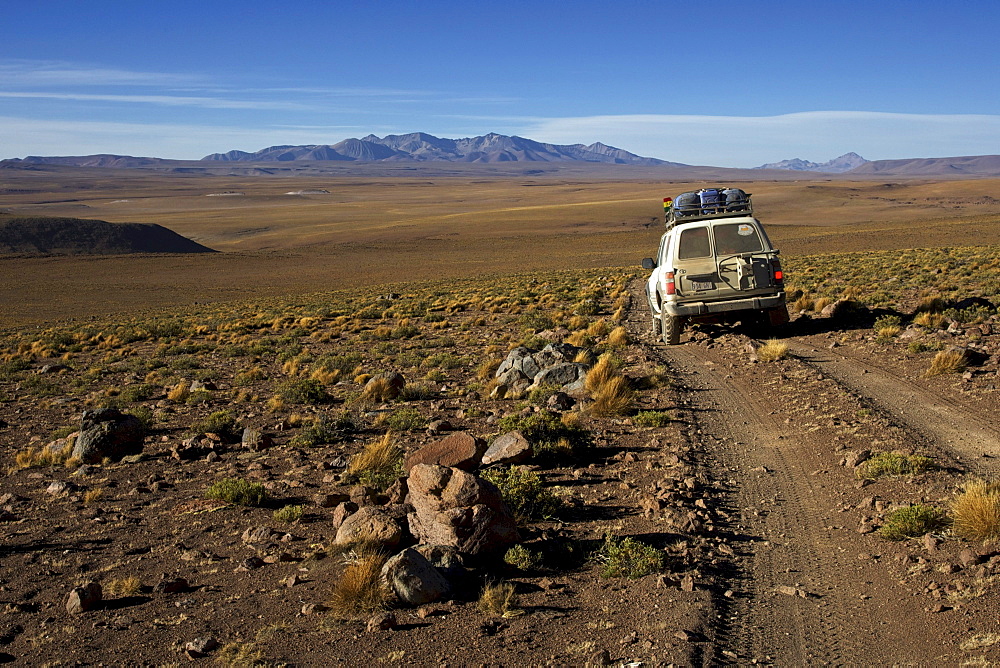 Off-road vehicle on a gravel road, Atacama Desert, Altiplano, southern Bolivia, South America