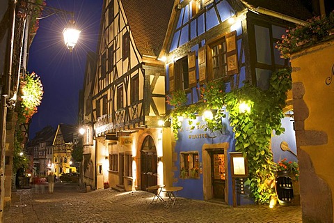 Winery and half-timbered houses at night, Riquewihr, Alsace, France, Europe