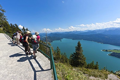 Hikers taking in the views from Mt Herzogstand across Walchensee Lake, district of Bad Toelz-Wolfratshausen, Upper Bavaria, Bavaria, Germany, Europe, PublicGround