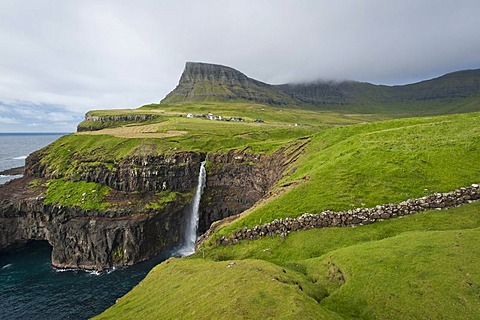 Waterfall into the sea, coast, Gasadalur, Vagar, Faroe Islands, Denmark, North Atlantic