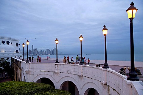 Lanterns along the promenade, Paseo Esteban Huertas, in front of the skyline of Panama City at dusk, Panama, Central America