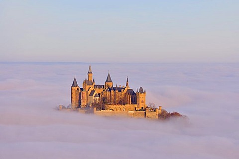 Burg Hohenzollern castle in morning light, early morning fog, Swabian Alb, Baden-Wuerttemberg, Germany, Europe