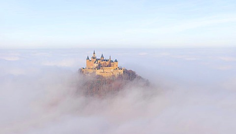 Burg Hohenzollern castle in morning light, early morning fog, Swabian Alb, Baden-Wuerttemberg, Germany, Europe