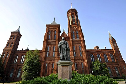 Statue of scientist Joseph Henry in front of the Smithsonian Institution Building, admin and museum building, known as "the Castle", National Mall, Washington DC, District of Columbia, United States of America, USA, PublicGround