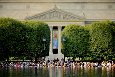 Miniature view, toy view, tilt-shift-effect, people relaxing at the lake of the National Gallery of Art Sculpture Garden Museum, Archives of the United States Building at back, Smithsonian Institution, National Mall, Washington DC, District of Columbia, U