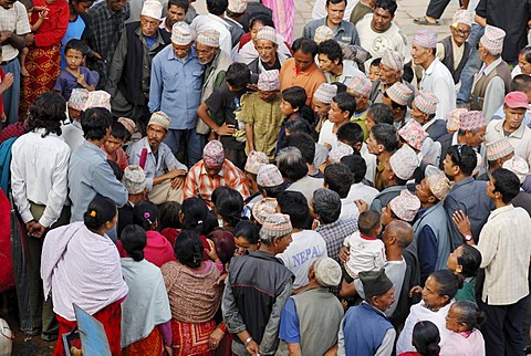 Men and women talking on the Taumadhi square, Bhaktapur, Kathmandu Valley, Nepal, Asia