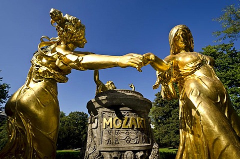 Dancing golden statues of the Mozart monument, Dresden, Saxony, Germany, Europe