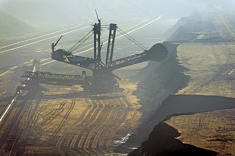 Bucket-wheel excavator in the mist, Tagebau Garzweiler open pit mine, Grevenbroich, North Rhine-Westphalia, Germany, Europe