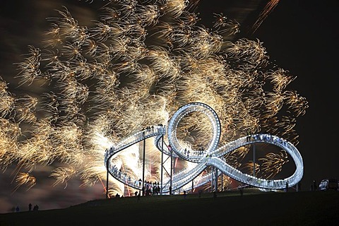 Fireworks display during opening of the walkable landmark sculpture in the shape of a roller coaster, "Tiger & Turtle ? Magic Mountain" by Heike Mutter and Ulrich Genth, Angerpark on Heinrich-Hildebrand-Hoehe, mining waste tip, Duisburg, North Rhine-Westp