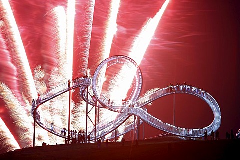 Fireworks display during opening of the walkable landmark sculpture in the shape of a roller coaster, "Tiger & Turtle ? Magic Mountain" by Heike Mutter and Ulrich Genth, Angerpark on Heinrich-Hildebrand-Hoehe, mining waste tip, Duisburg, North Rhine-Westp