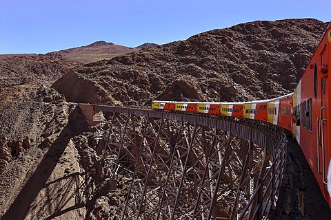 Tourist attraction Tren a las Nubes, Train to the Clouds, on the Polvorillo Viaduct, in the High Andes, near Salta, borderland Argentina - Bolivia, South America