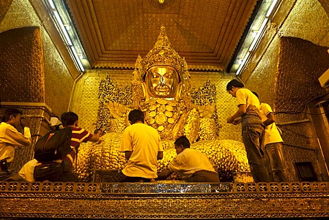 The most holy Buddha of the country, the golden Mahamuni Buddha is covered in gold leaf by believers, Mandalay, Burma, Myanmar, Southeast Asia, Asia