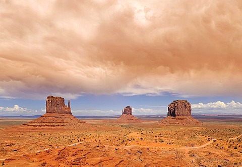 Approaching sandstorm, West Mitten Butte, East Mitten Butte and Merrick Butte table mountains and Scenic Drive, Monument Valley, Navajo Tribal Park, Navajo Nation Reservation, Arizona, Utah, United States of America